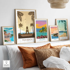 Framed Palm Beach Wall Art and vintage travel posters on display, showcasing coastal destinations like Lake Como and Amalfi Coast.