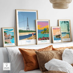 Paris wall art prints displayed in a stylish living room with vintage travel themes and cozy decor.