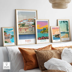 Porto Wall Art Portugal Print featured among other travel posters on a stylish shelf in a cozy living space.