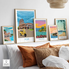 Vintage-inspired Rome travel poster print displayed among other scenic art prints on a stylish living room wall.