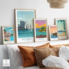 A stylish display of travel posters featuring Rotterdam, Lake Como, and more, perfect for home decor.