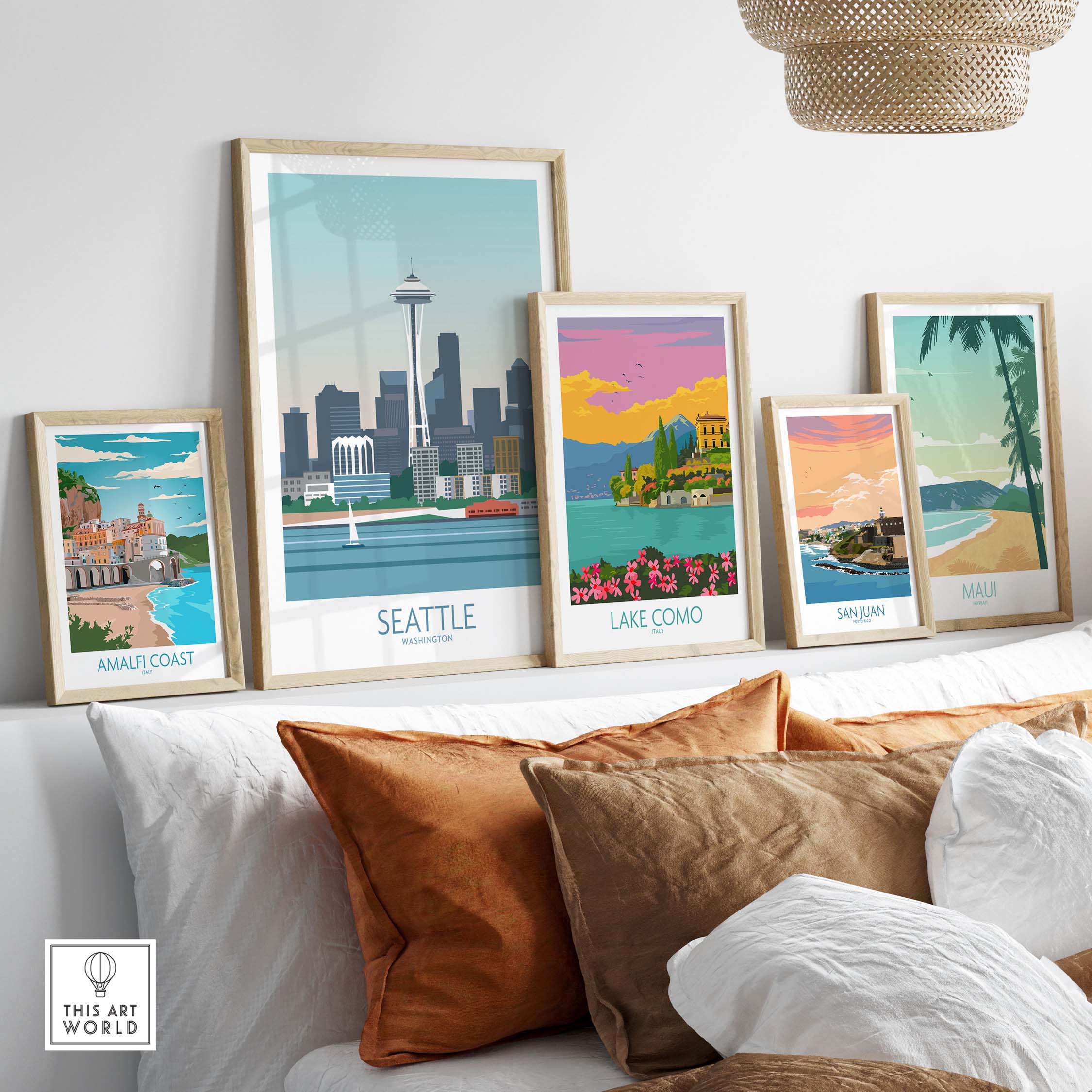 Seattle poster print among vintage travel art featuring Lake Como, San Juan, Maui, and Amalfi Coast in a stylish home setting.