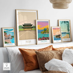 Stylish Seoul Print South Korea Travel Poster framed among other vintage travel artworks on a modern shelf.