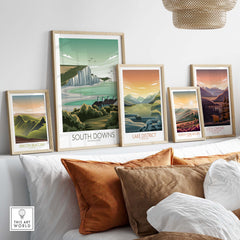 Stylish framed landscape prints of South Downs, Lake District, North York Moors, and more adorning a living room wall.
