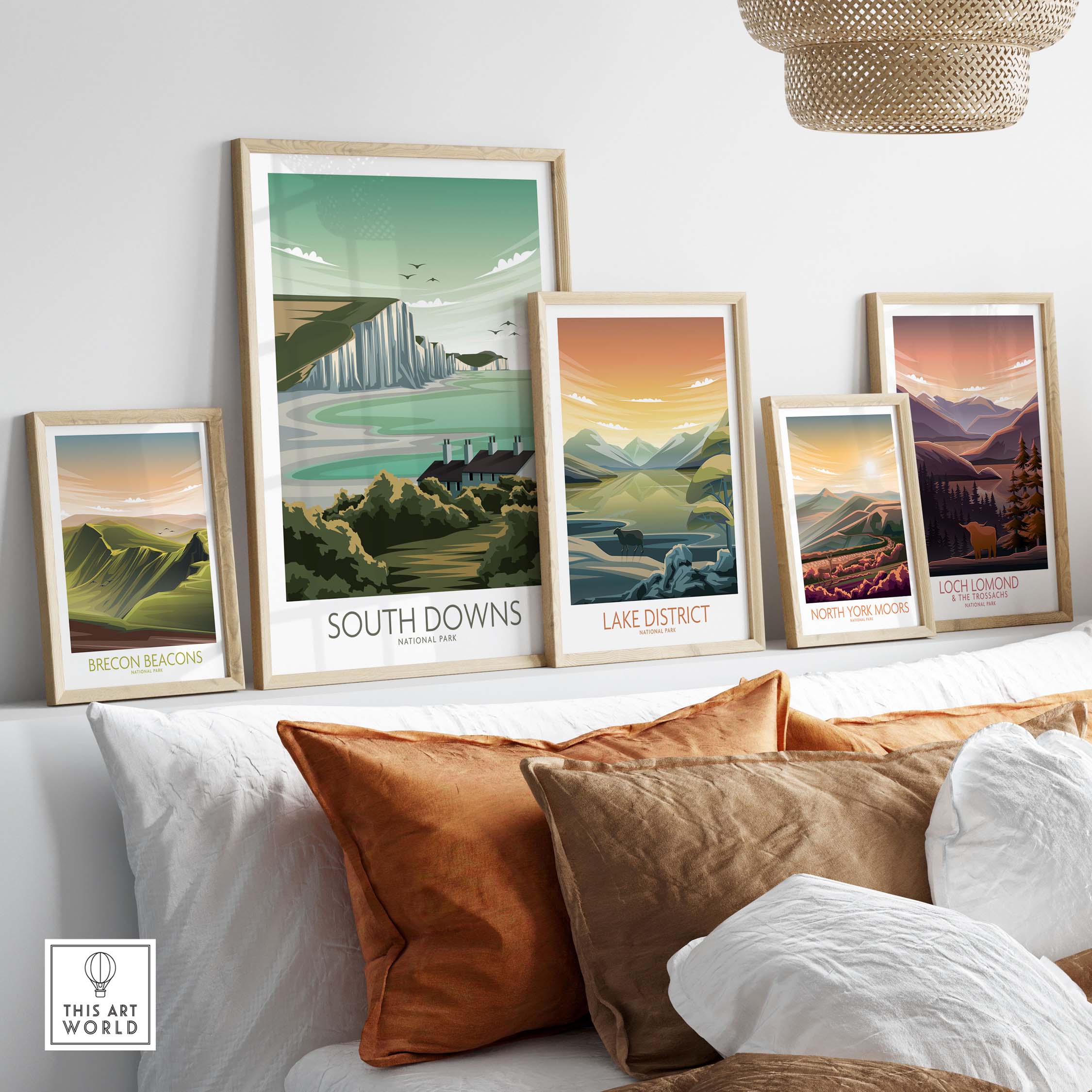 Stylish framed landscape prints of South Downs, Lake District, North York Moors, and more adorning a living room wall.
