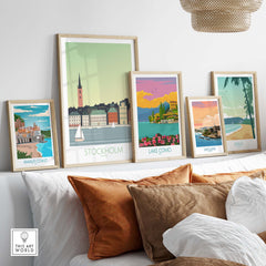 Colorful framed travel posters including Stockholm, Lake Como, and more, styled in a cozy home setting.
