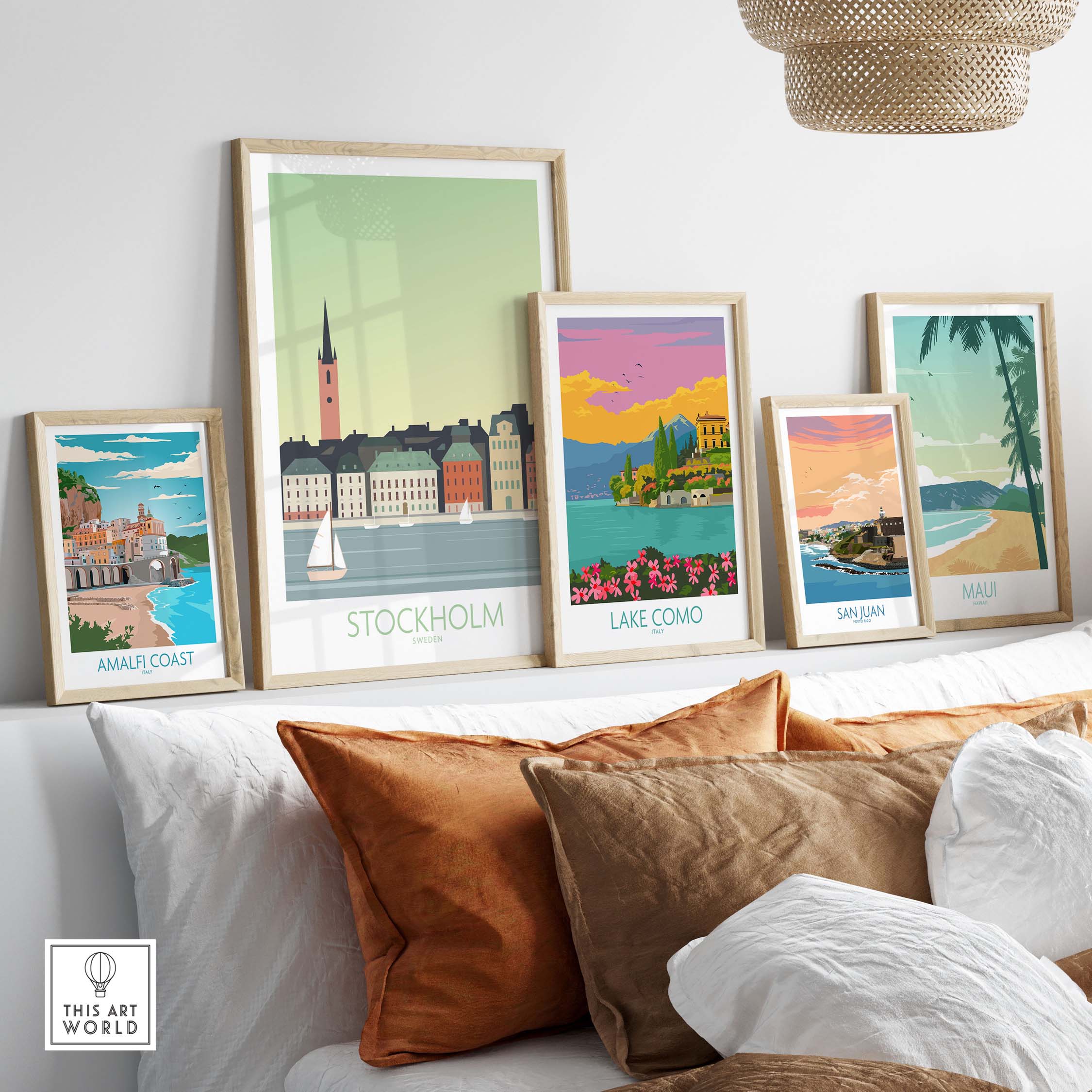 Colorful framed travel posters including Stockholm, Lake Como, and more, styled in a cozy home setting.