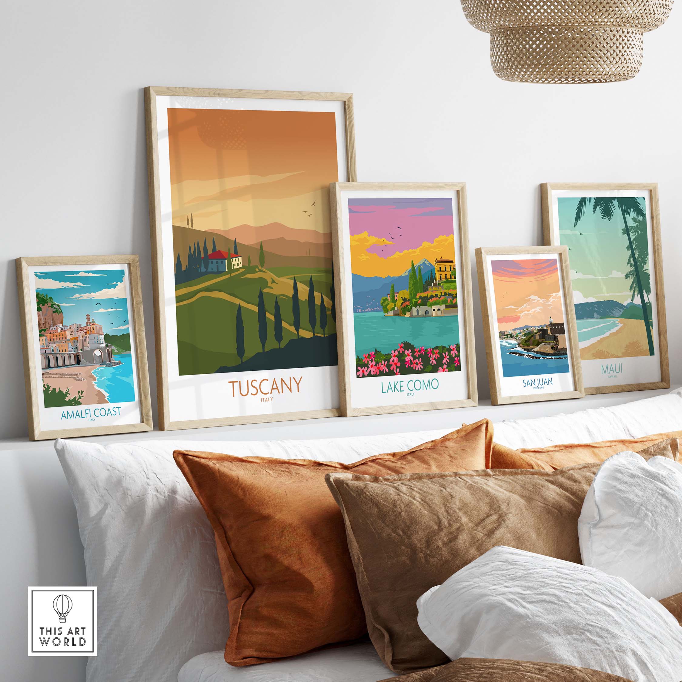 Framed Tuscany and Italian travel art prints displayed on a shelf in a cozy home setting.