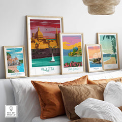 Valletta Print Malta Poster and other vintage travel art prints displayed on a stylish sofa.