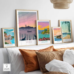 Venice Print Travel Poster displayed among framed art, showcasing nostalgic travel destinations in a stylish living room setting.