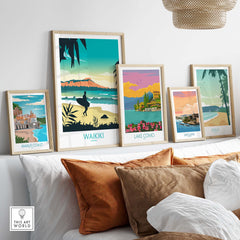Waikiki Hawaii poster print and travel art collection displayed on a shelf with stylish framing in a modern living space.