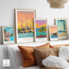 Wall display of Zaragoza Spain poster and other vintage travel posters in a stylish living room setup.