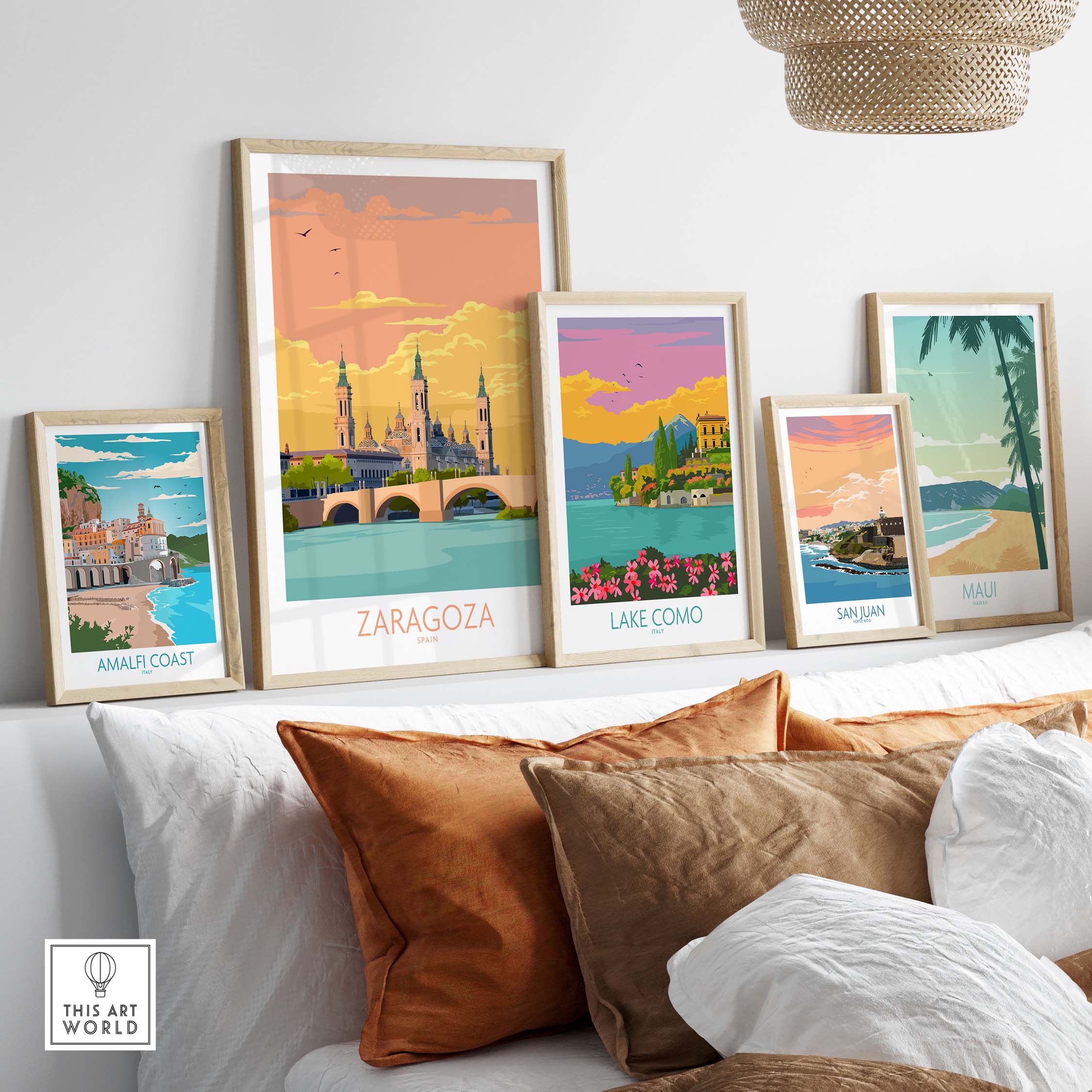 Wall display of Zaragoza Spain poster and other vintage travel posters in a stylish living room setup.
