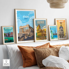 Framed Athens Greece Art Print displayed among other city posters on a cozy couch setting, showcasing stylish wall art.