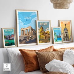 Framed vintage travel posters featuring Amsterdam, Athens, Rome, New York, and Madrid on a stylish wall.