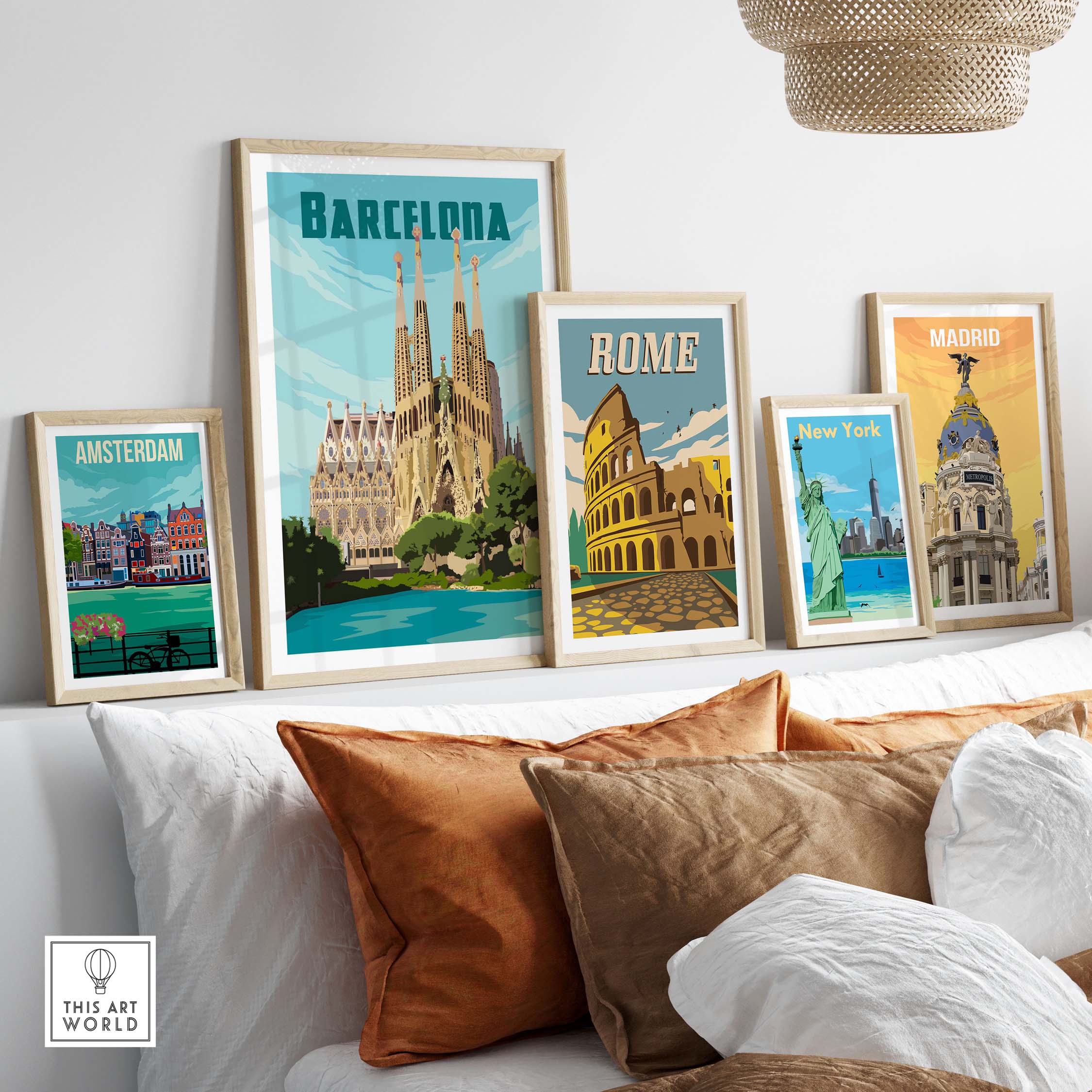 Framed vintage travel posters of Barcelona, Rome, New York, Amsterdam, and Madrid on a stylish sofa setting.