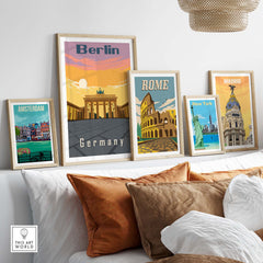 Berlin Poster and travel prints of Amsterdam, Rome, and Madrid displayed on a stylish living room wall.
