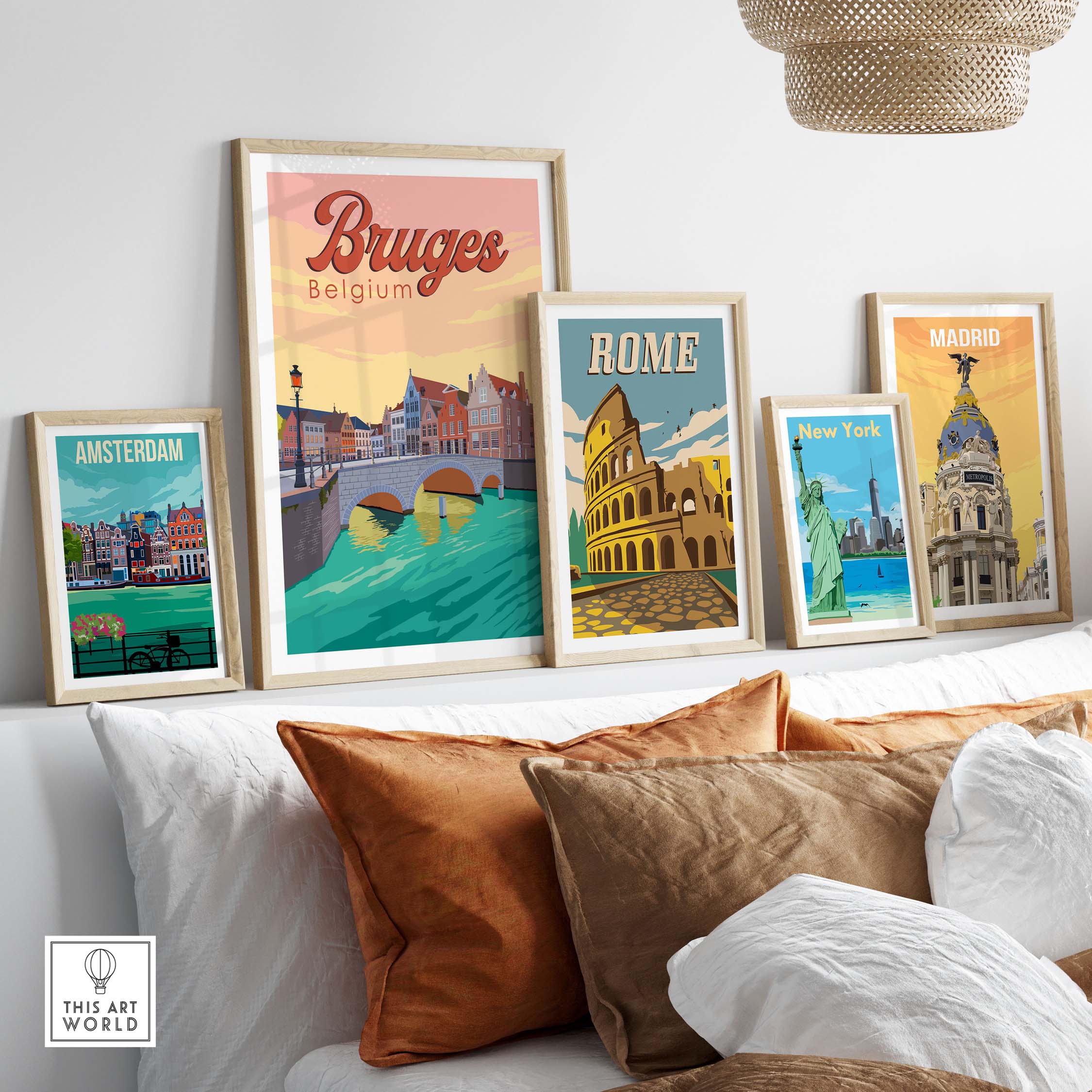 Framed Bruges, Rome, Madrid, Amsterdam, and New York vintage travel posters displayed on a stylish wall.