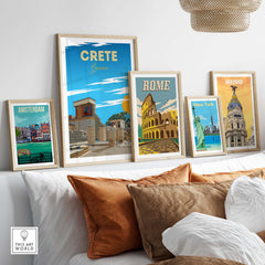 Framed travel poster prints including Crete, Rome, Amsterdam, Madrid, and New York on a stylish home decor setting.