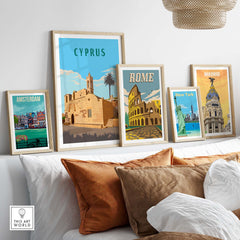 Framed vintage travel posters featuring Cyprus, Rome, Madrid, New York, and Amsterdam in a stylish living room setting.