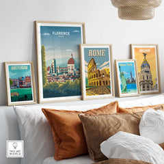 Framed Florence Wall Art Print alongside travel posters of Amsterdam, Rome, New York, and Madrid in a stylish living room setting.