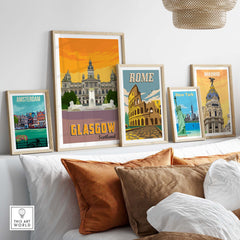 Framed Glasgow Poster Print showcasing Scotland amidst other travel posters in a modern living space.