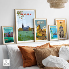 Framed vintage travel posters of Hamburg, Rome, Amsterdam, New York, and Madrid displayed on a stylish wall.