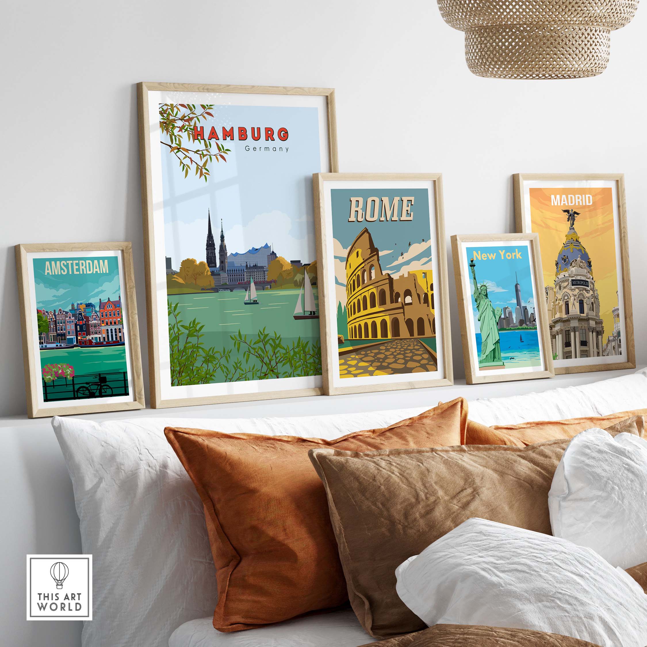 Framed vintage travel posters of Hamburg, Rome, Amsterdam, New York, and Madrid displayed on a stylish wall.