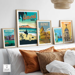 Framed travel posters including Hawaii Waikiki, Rome, New York, and Madrid displayed on a shelf.