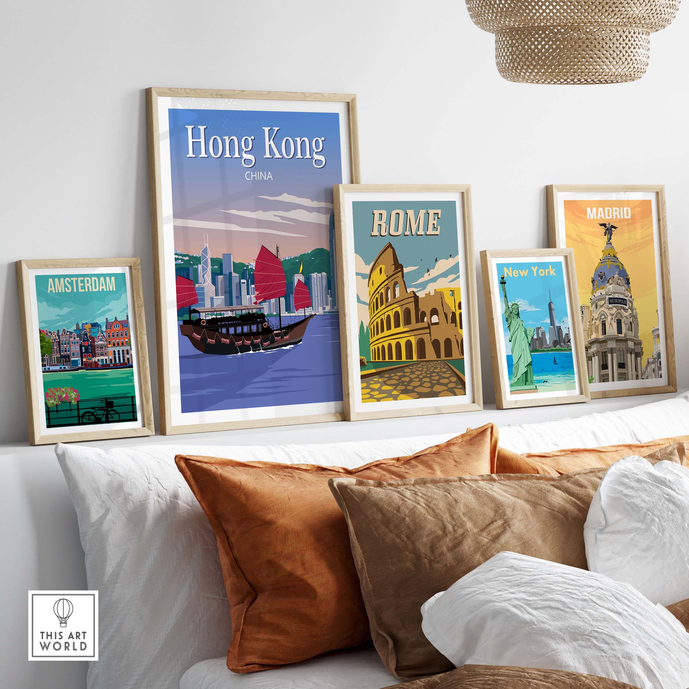 Framed travel poster prints featuring Hong Kong, Rome, Madrid, New York, and Amsterdam in a stylish interior setting.