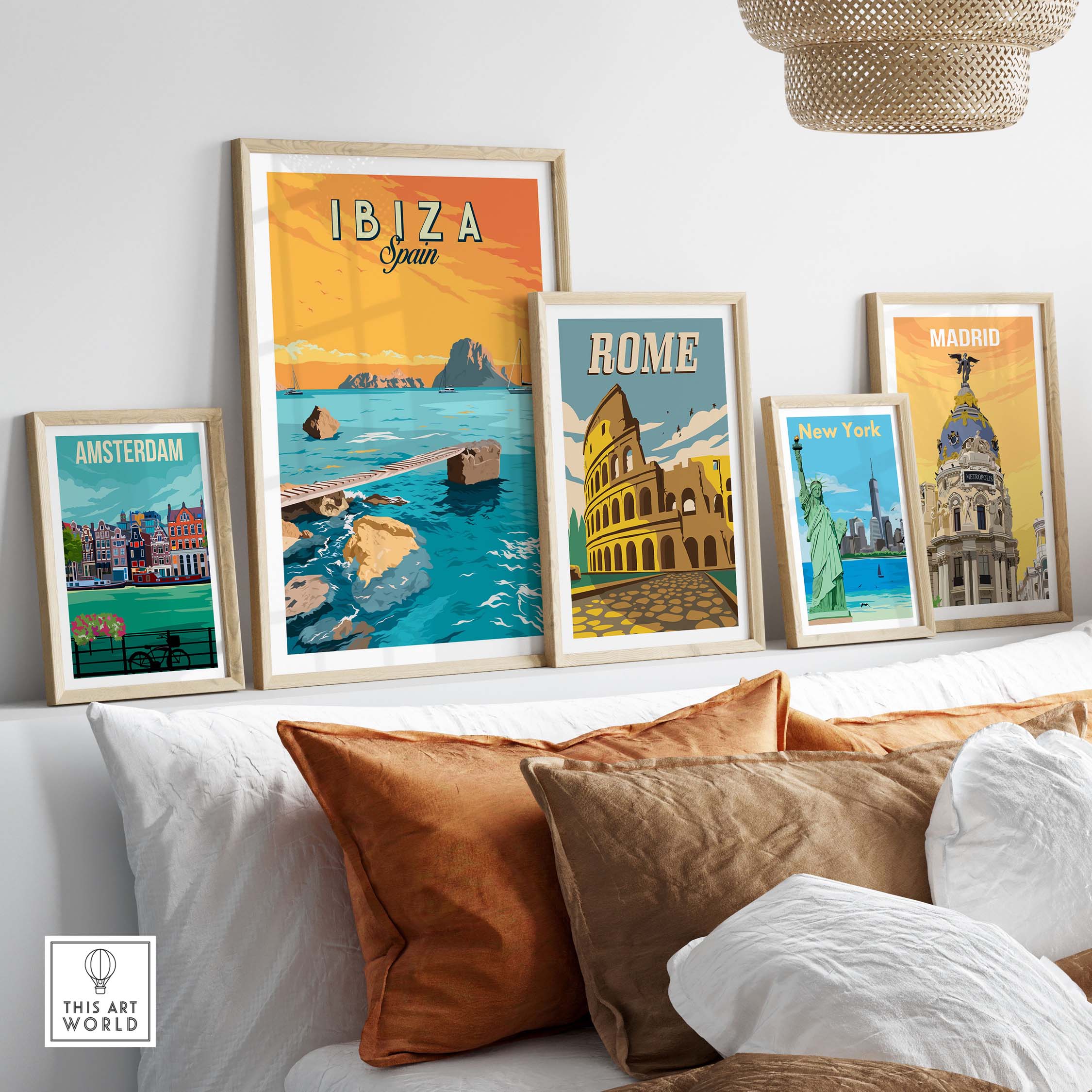 Ibiza Print Spain Sunset Poster displayed among framed vintage travel posters in a stylish living room.