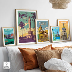 Stylish travel posters featuring Izmir, Rome, Madrid, New York, and Amsterdam on a cozy sofa backdrop.