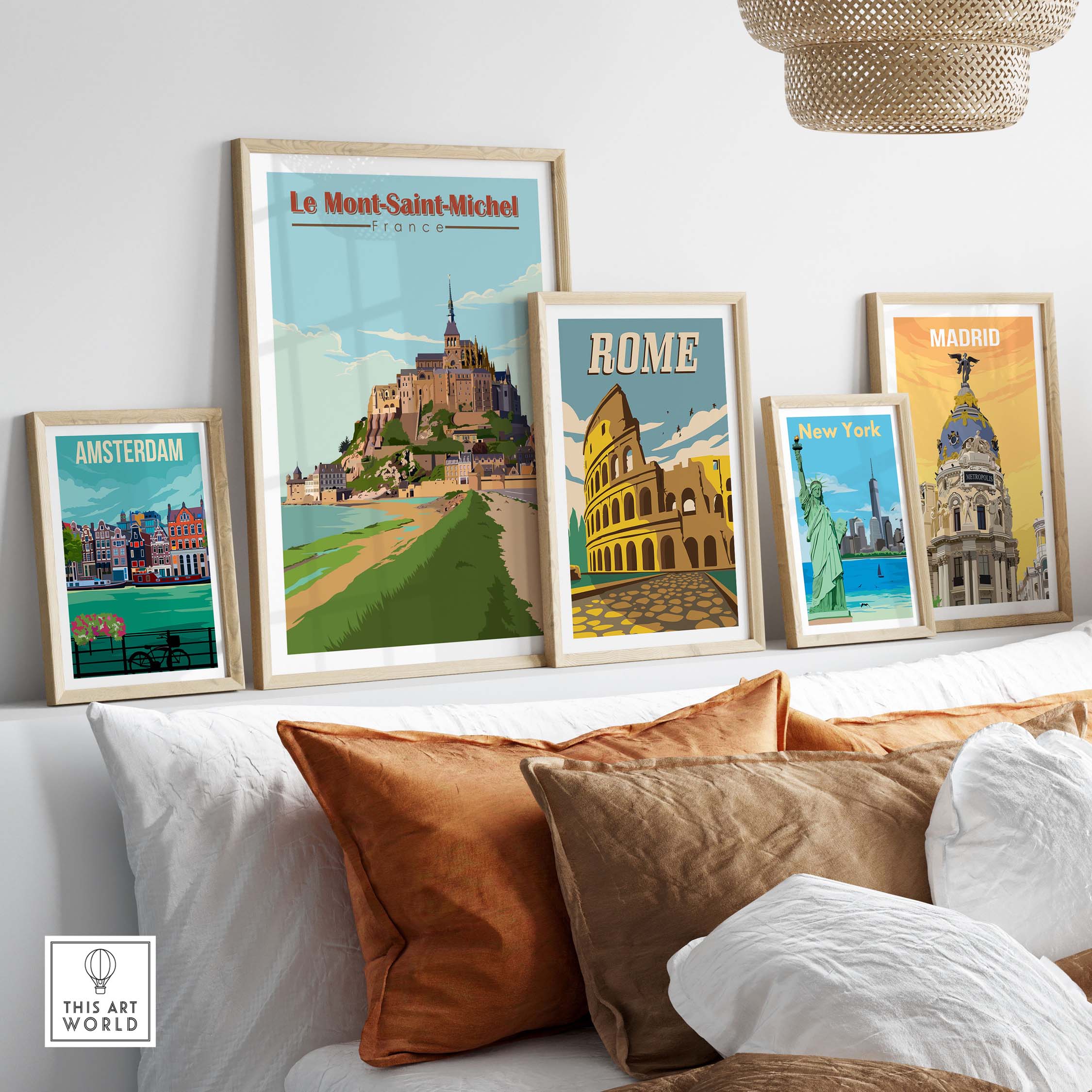 Framed vintage travel posters including Le Mont Saint Michel, Rome, Madrid, and Amsterdam displayed in a stylish interior.
