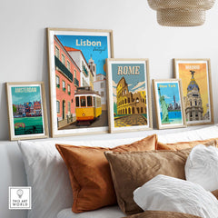 Lisbon travel poster print with framed artworks of famous cities like Rome, Amsterdam, and New York displayed on a stylish sofa.