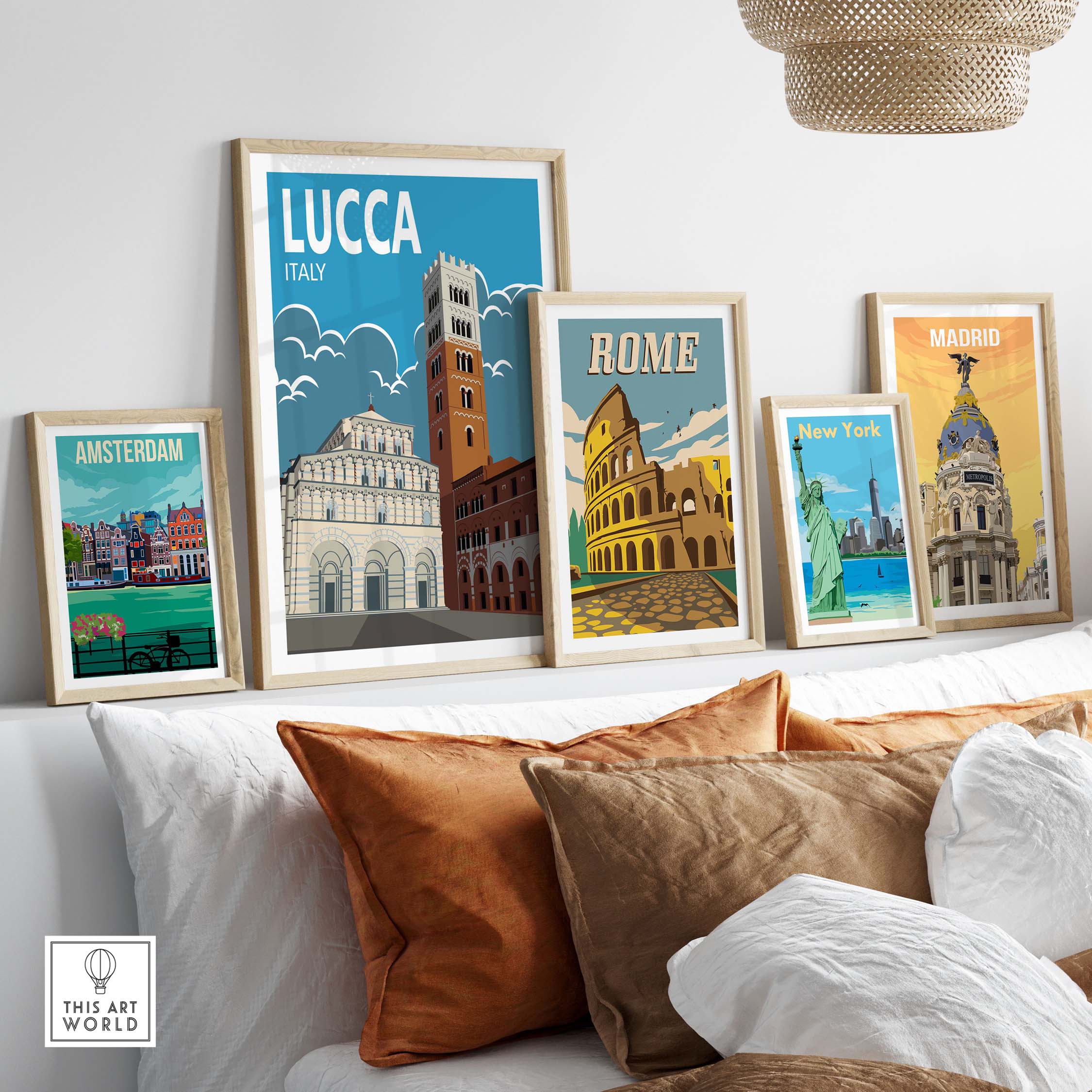 Lucca Italy wall art print displayed with other city posters on a stylish sofa in a modern living room.
