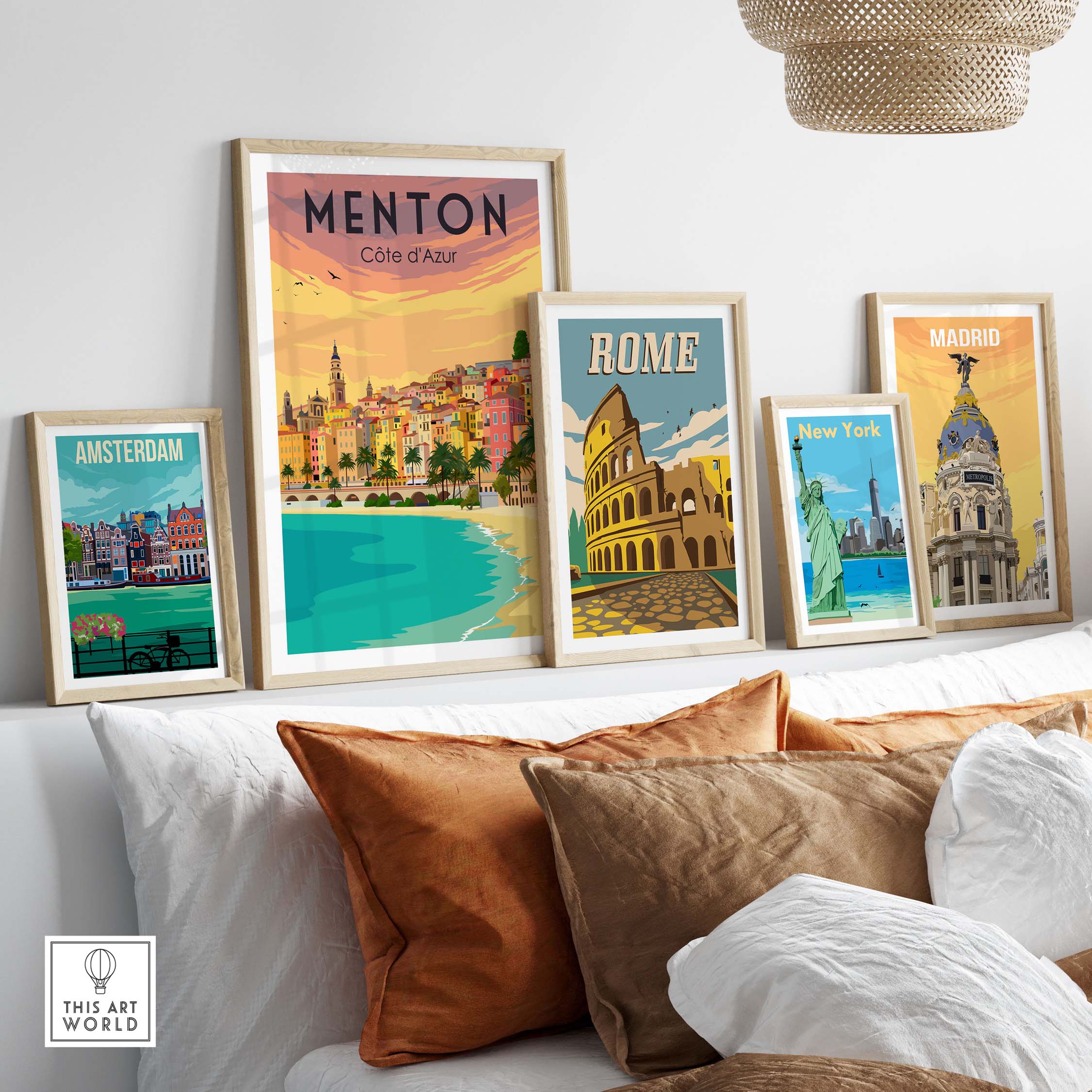 Framed vintage travel posters including Menton, Rome, Amsterdam, and Madrid displayed in a stylish living room setting.