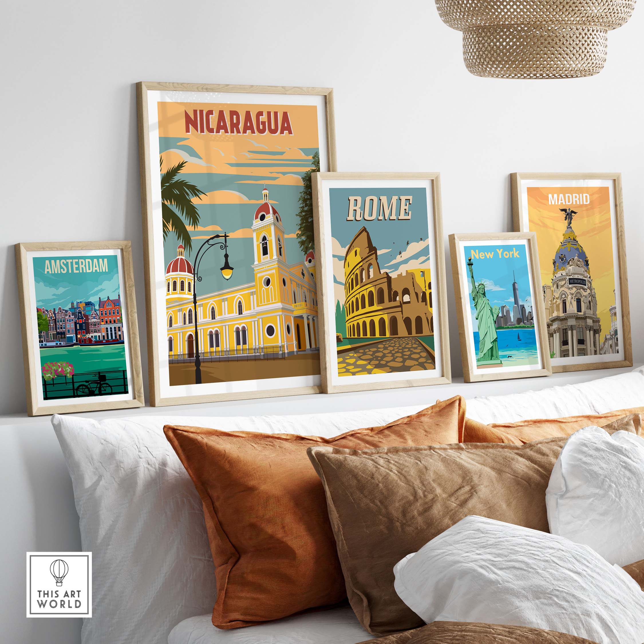 Nicaragua and travel posters displayed in stylish frames on a cozy sofa setting, showcasing vintage travel art.