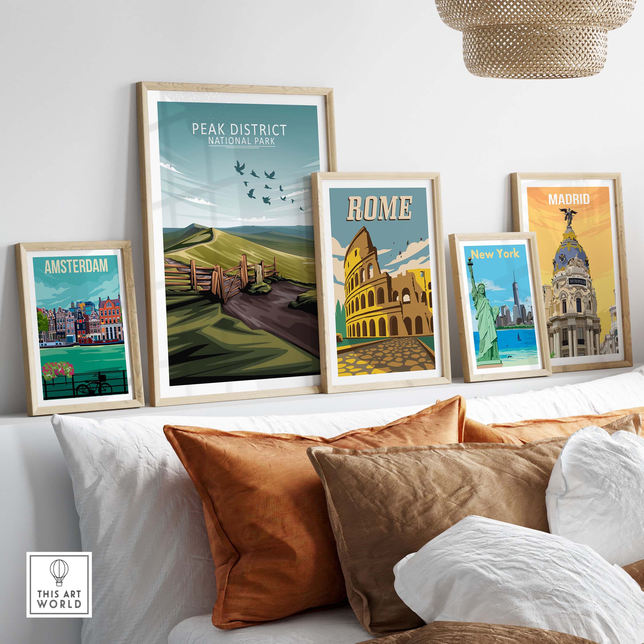 Framed Peak District National Park poster among travel-themed art prints displayed in a stylish living room setting.
