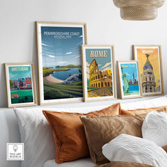 Framed Pembrokeshire Coast National Park poster among other city prints on a stylish interior wall.