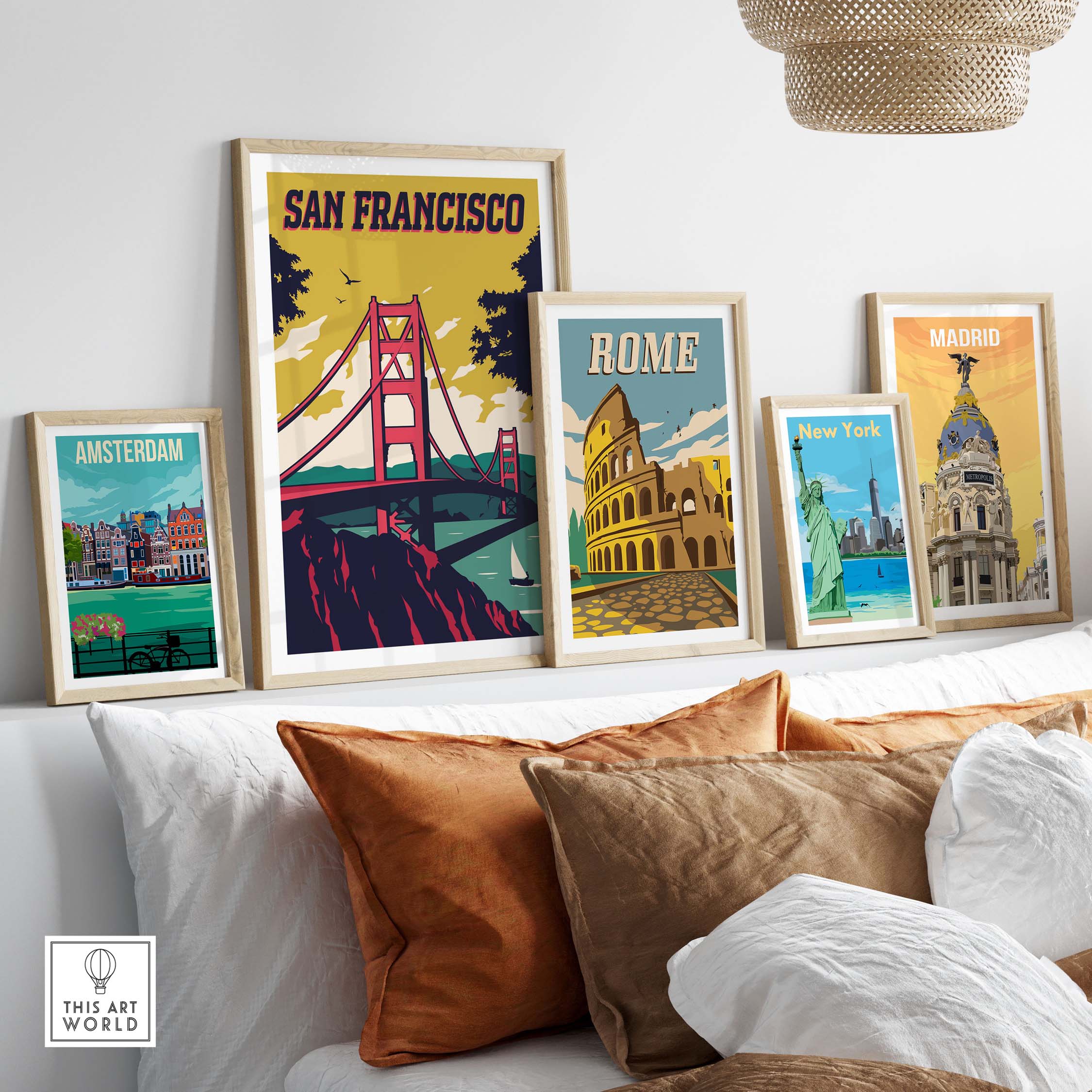 San Francisco Poster Wall Art Print alongside framed posters of Amsterdam, Rome, and New York on a stylish couch.