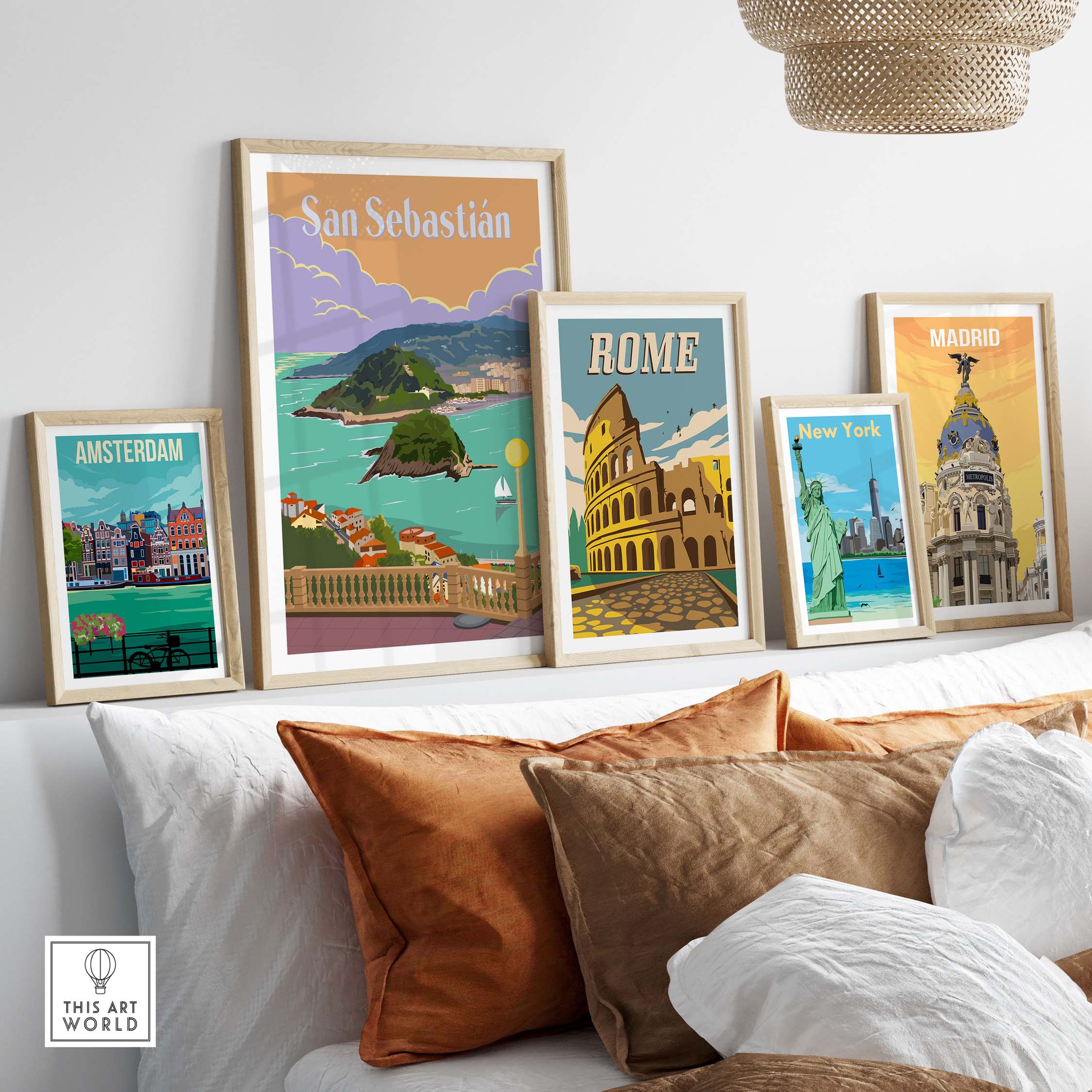San Sebastian Spain poster print among framed vintage travel art from Amsterdam, Rome, and Madrid in a stylish home setting.