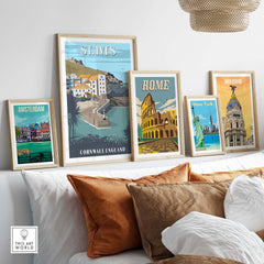 Stylish gallery wall featuring St Ives, Rome, Madrid, Amsterdam prints in minimalist frames on a cozy sofa.