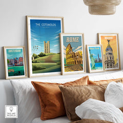 Stylish travel posters including The Cotswolds, Amsterdam, Rome, and Madrid in a modern home setting.