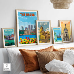 Framed travel wall art featuring The Hague, Amsterdam, Rome, New York, and Madrid in a stylish living room setting.