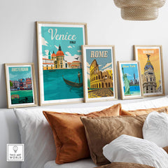 Vintage Venice poster art print displayed with other travel posters in a stylish living room setting.