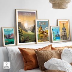 Yosemite National Park poster among framed travel prints of Amsterdam, Rome, and Madrid in a cozy home setting.