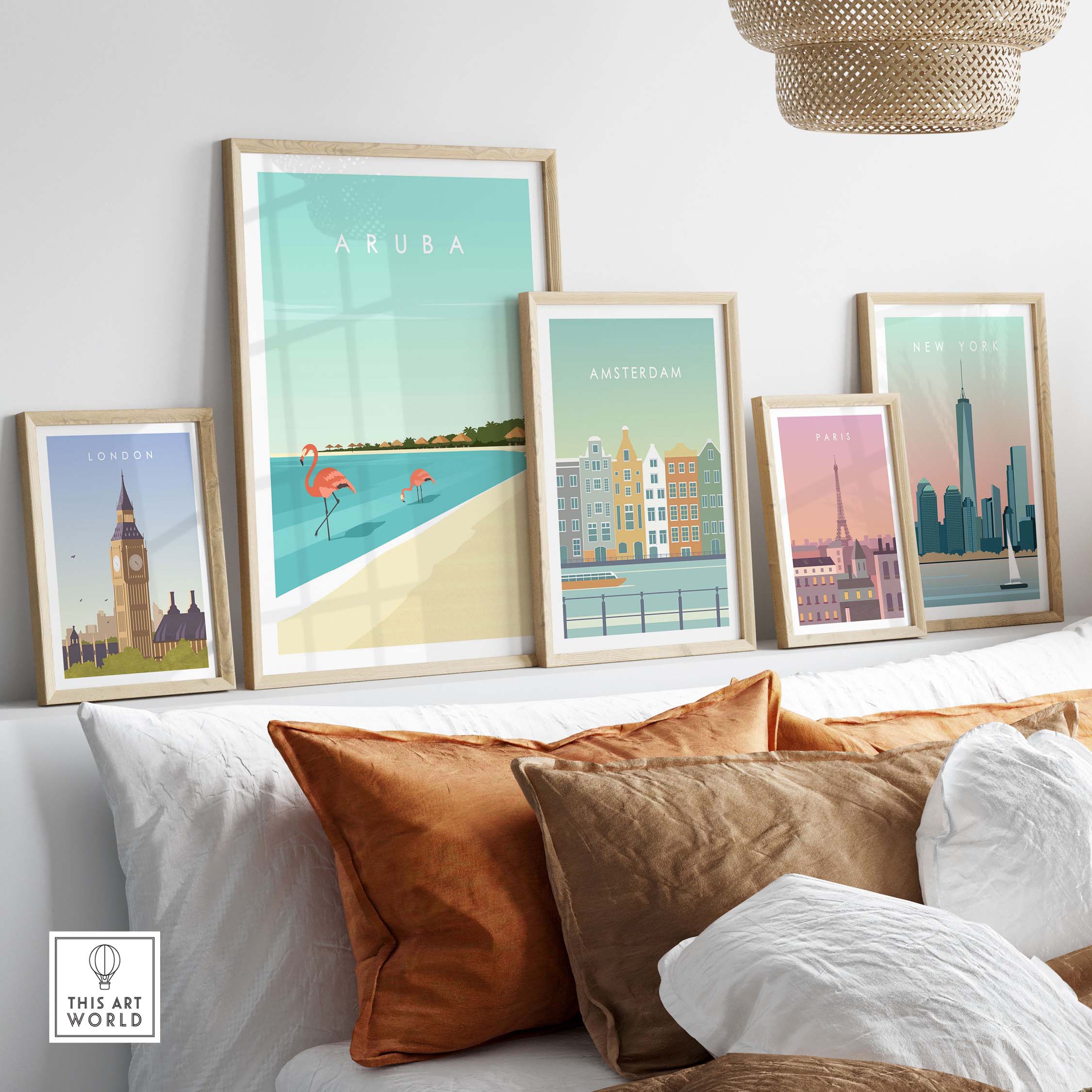 Collection of framed travel art prints featuring Aruba, London, Amsterdam, and Paris in a stylish home setting.