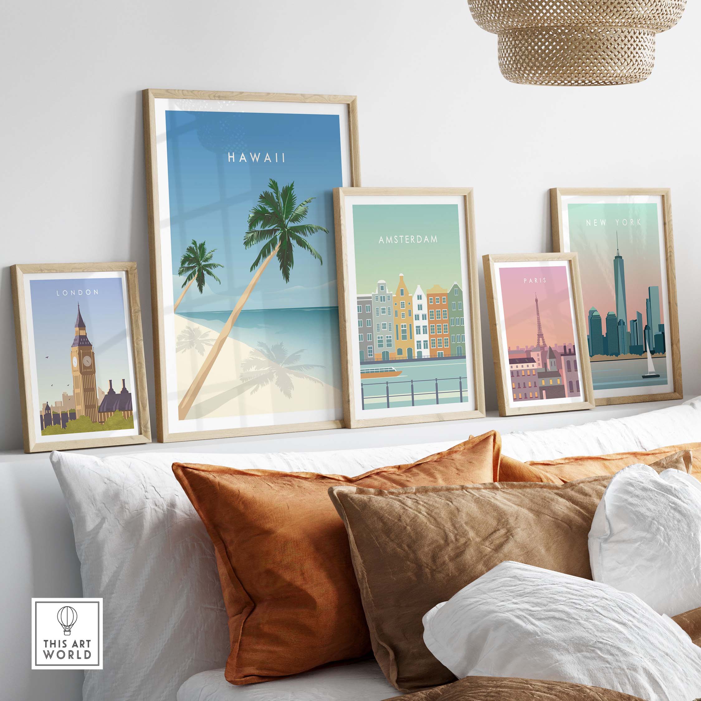 Hawaii wall art poster among framed travel posters of London, Amsterdam, and New York, displayed on a stylish couch.