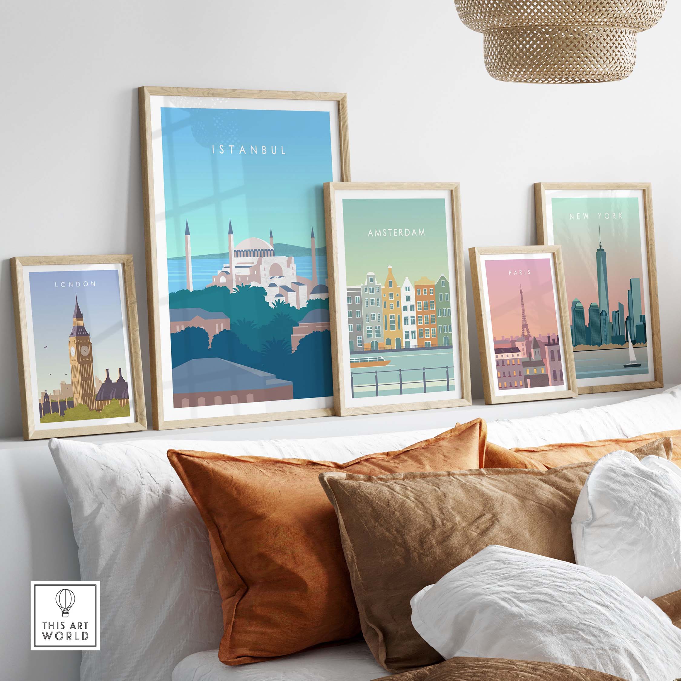 Framed Istanbul Print Wall Art Poster among other city prints on a stylish couch with decorative cushions.