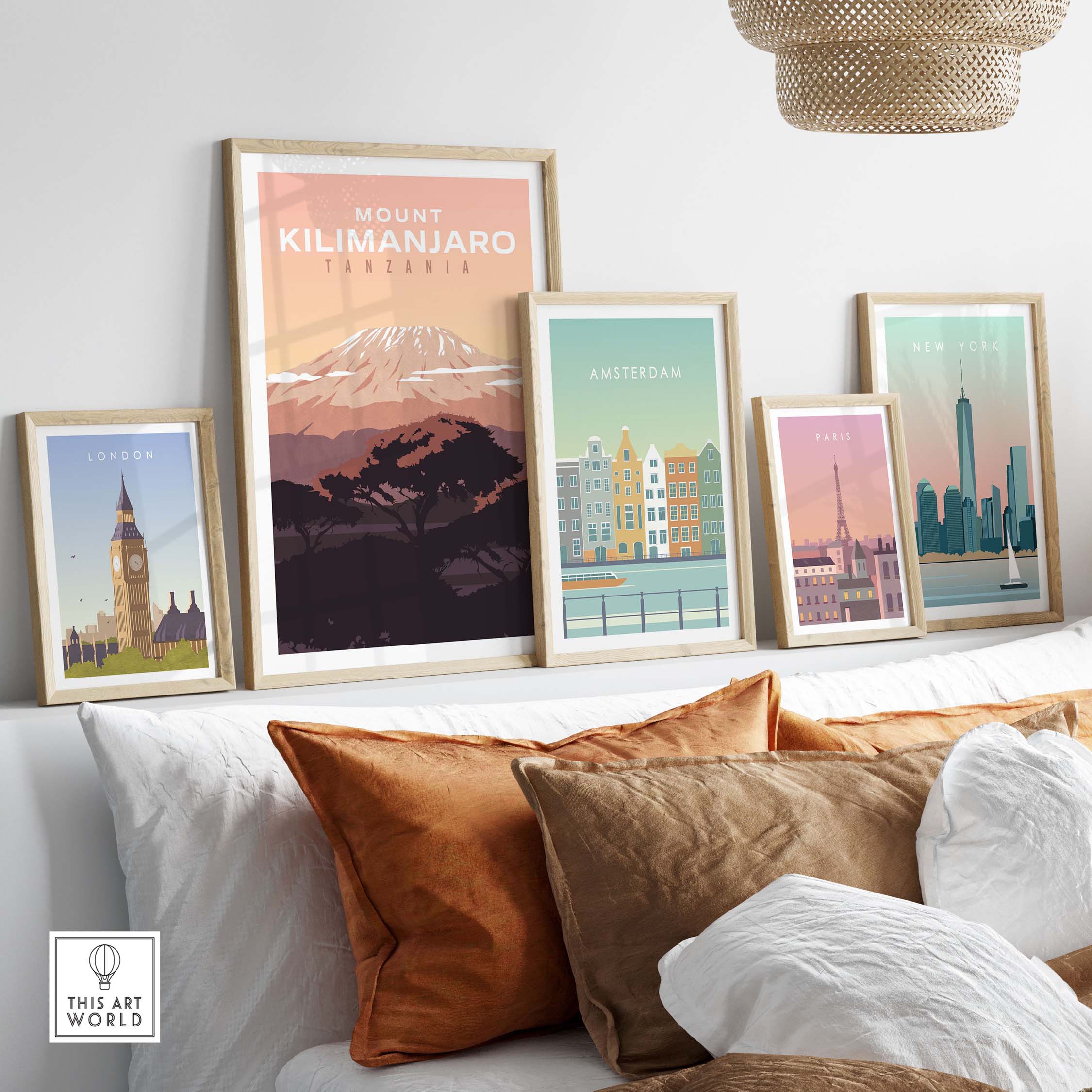 Kilimanjaro Print Wall Art Poster displayed with vintage city travel posters in a stylish home setting.